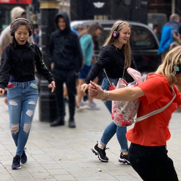 a group of people walking down the street
