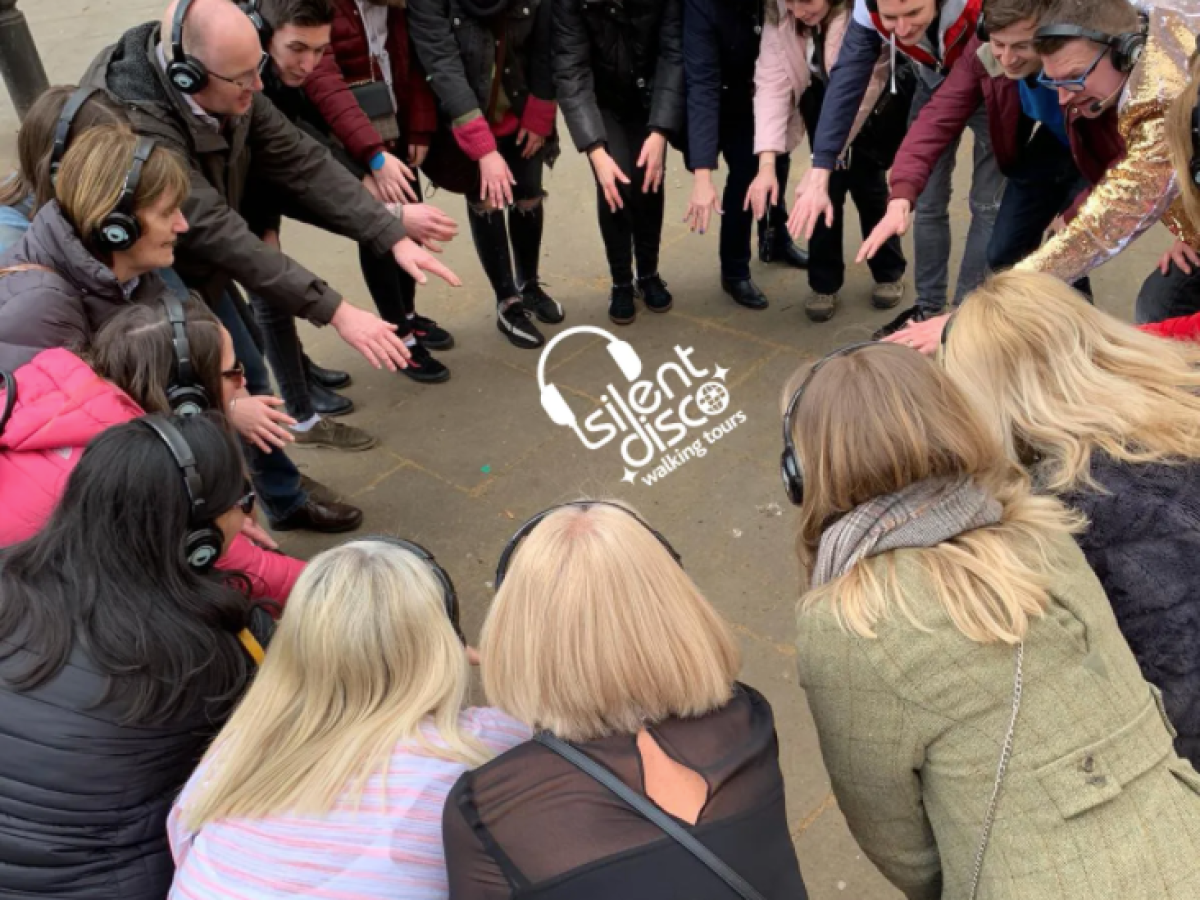 a group of people standing in front of a crowd